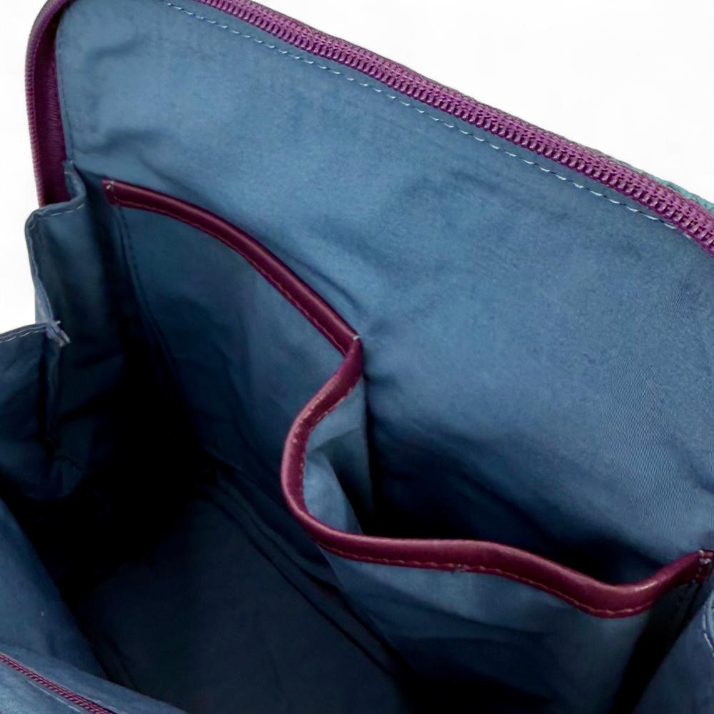 Green And Purple Plaid Harris Tweed mini backpack interior showing slip pockets and compartments.