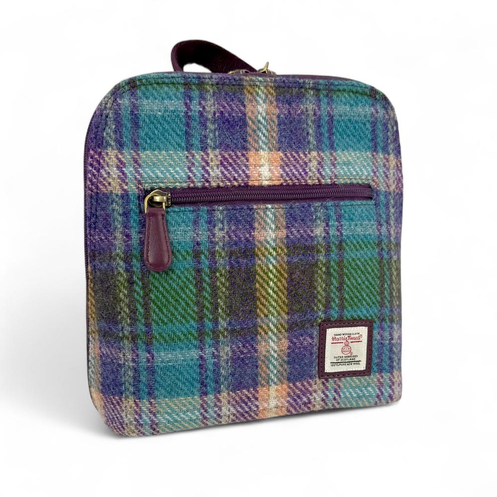 Green And Purple Plaid Harris Tweed mini backpack front angled view on white background.
