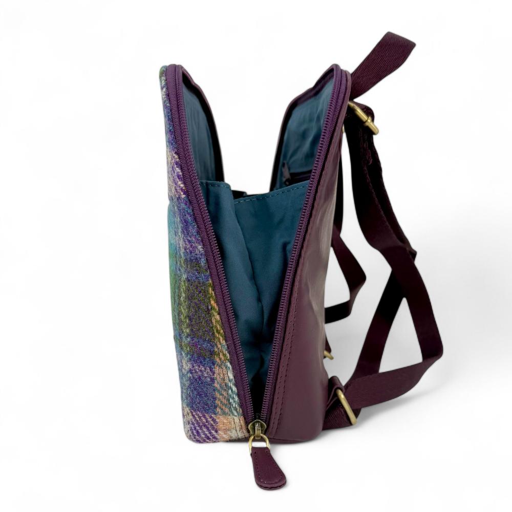 Green And Purple Plaid Harris Tweed mini backpack open side view showing zip-to-base design.