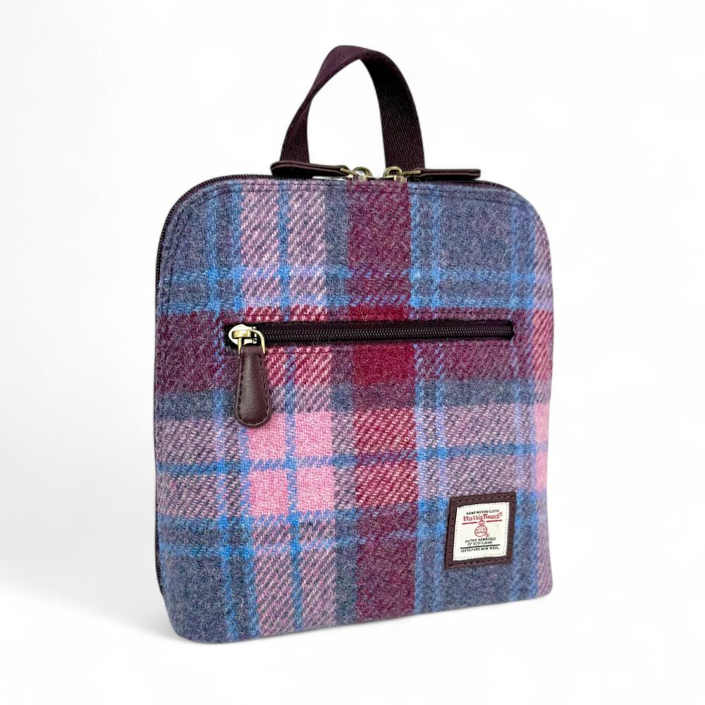 Pastel Pink Harris Tweed mini backpack front angled view on white background.