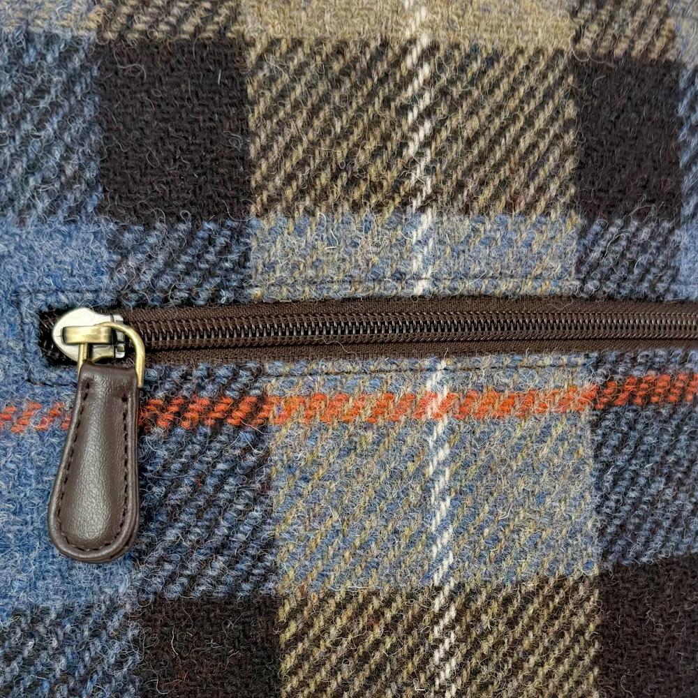 Maccessori embossed branding on dark brown vegan leather back panel.