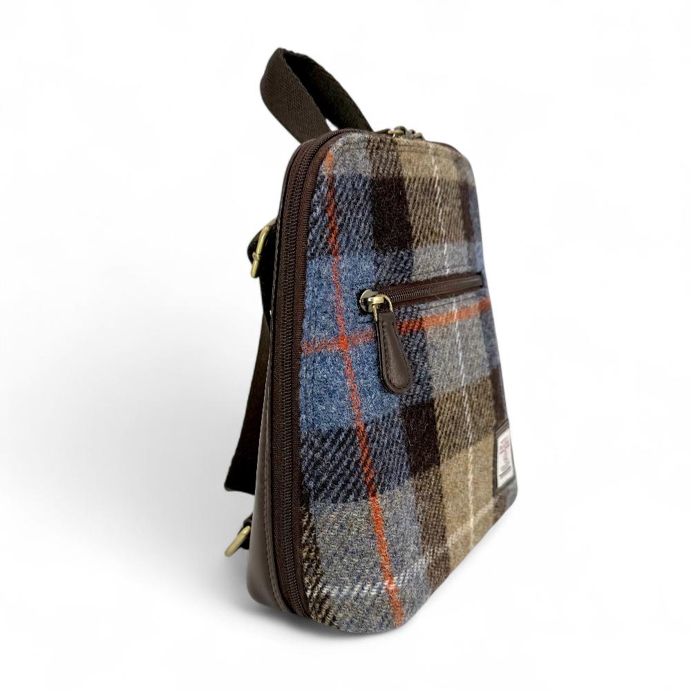 Blue And Brown Check Harris Tweed mini backpack side view showing zip pocket on white background.