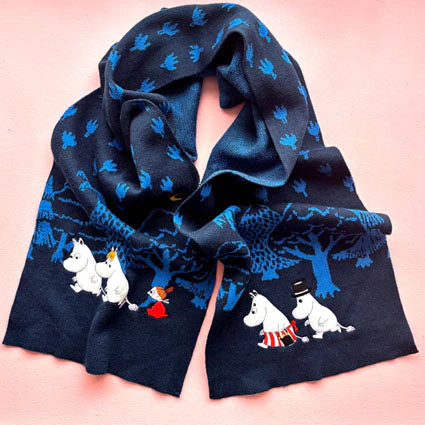 Moomin Blue Forest Embroidered Scarf featuring Moomin characters walking through a blue forest, displayed on a pink background.