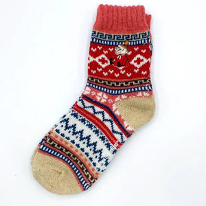 Single Moomin Fair Isle sock laid flat on white background, showing detailed knit and colourful pattern with Little My character.