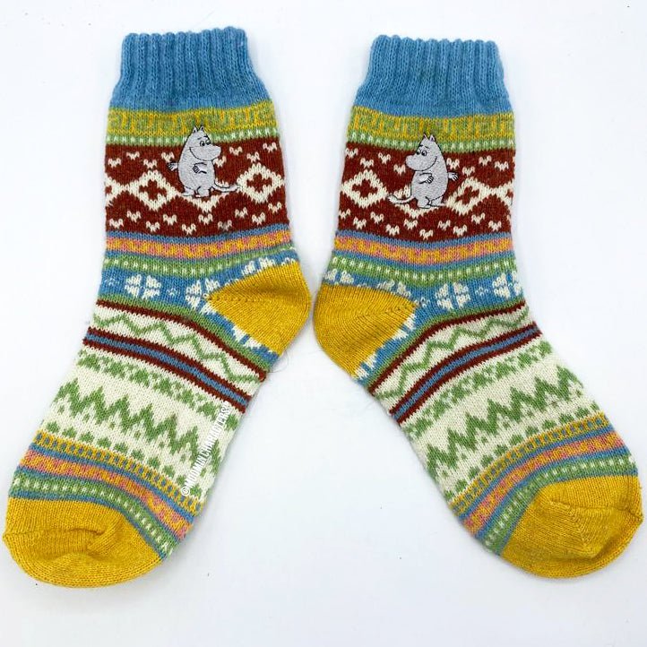 Pair of Moomin Fair Isle socks displayed flat with Moomin embroidery and colourful winter pattern.