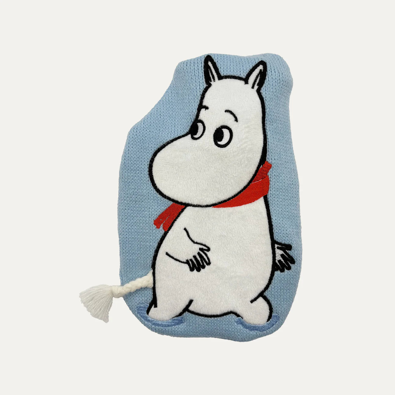 Close-up of Moomin applique design on baby blue knit mini hot water bottle.