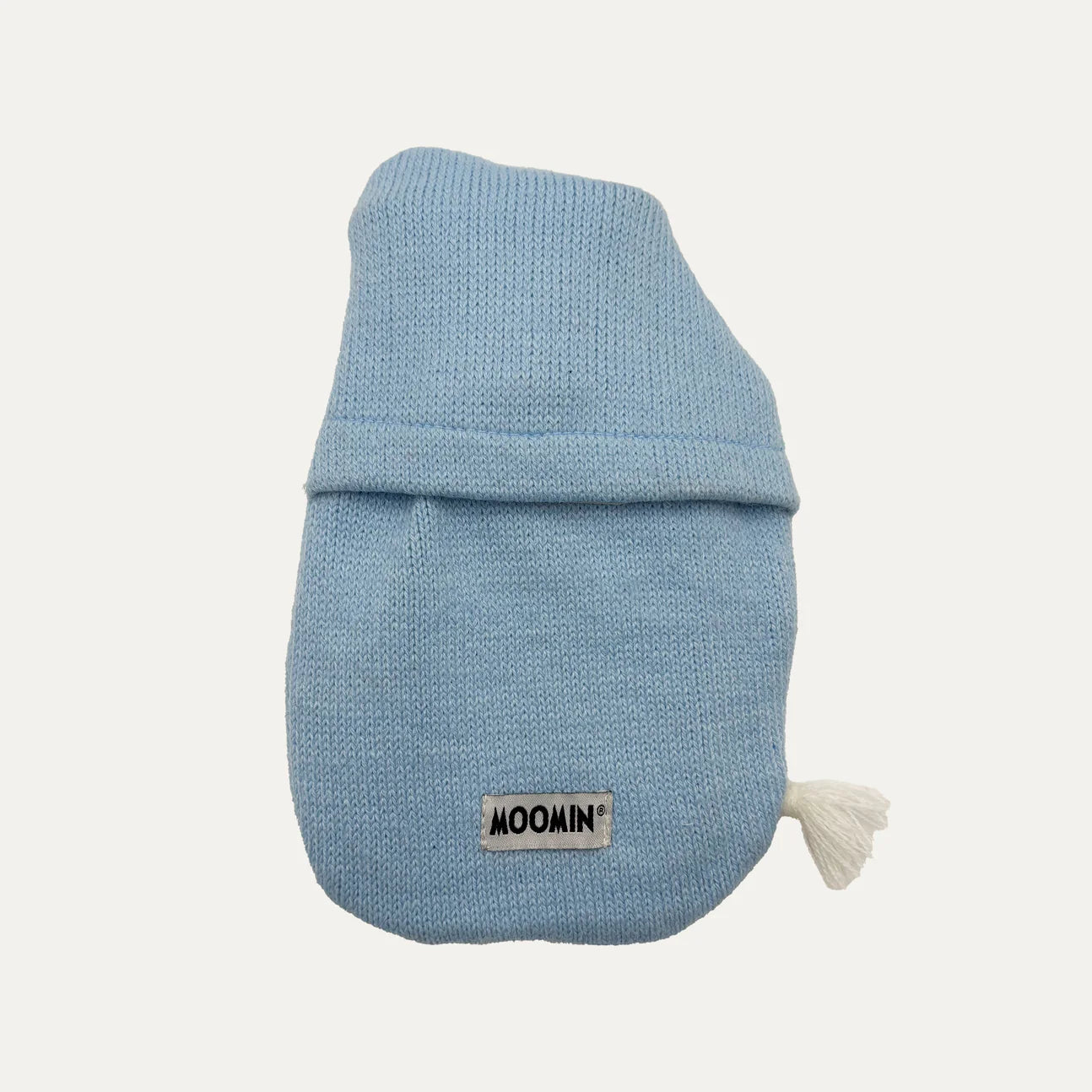 Rear view of Moomin mini hot water bottle with tassel detail and knit cover.