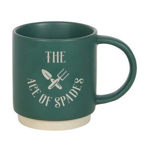 Close-up of green ceramic mug with white base and “The Ace of Spades” gardening design – unique gift for plant lovers.