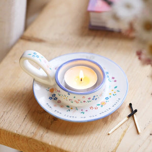 Mum Meaningful Word Handled Tealight Holder with lit candle on wooden table.