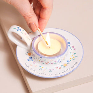 Ceramic tealight holder with floral design and ‘Mum, you light up our whole world’ quote.