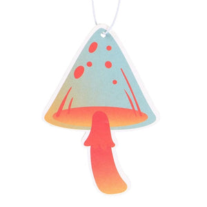 Close-up of funky mushroom air freshener with teal and orange toadstool design and smooth vanilla fragrance.