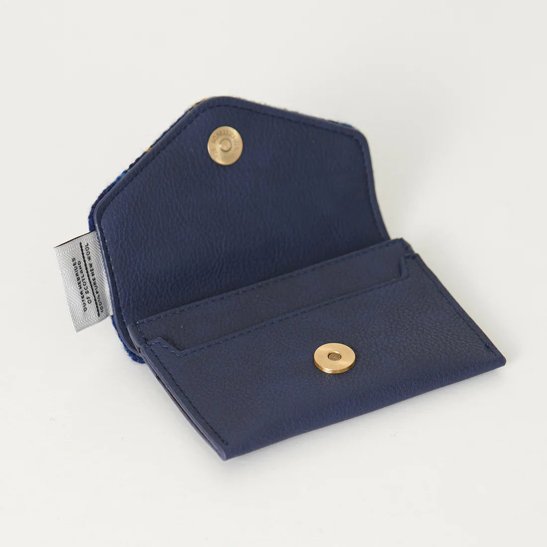 Inside the navy over-check harris tweed card holder. 