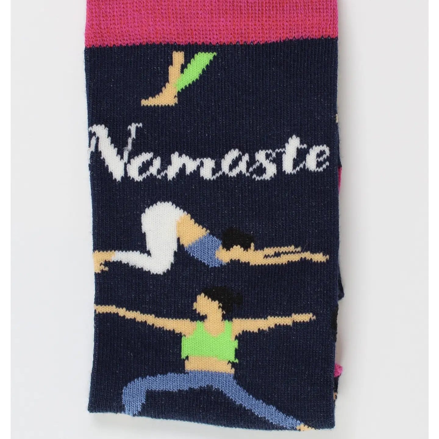Close-up of folded navy bamboo socks showing “Namaste” lettering and yoga pose design – sustainable women’s socks for yoga lovers.