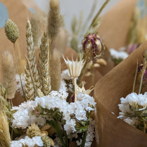 Close-up of the Natural Dried Flower Arrangement, showcasing delicate wheat stems and white florals.