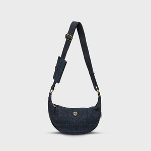 A navy over-check Harris Tweed Luna bag with a matching purse attached, on a white background.