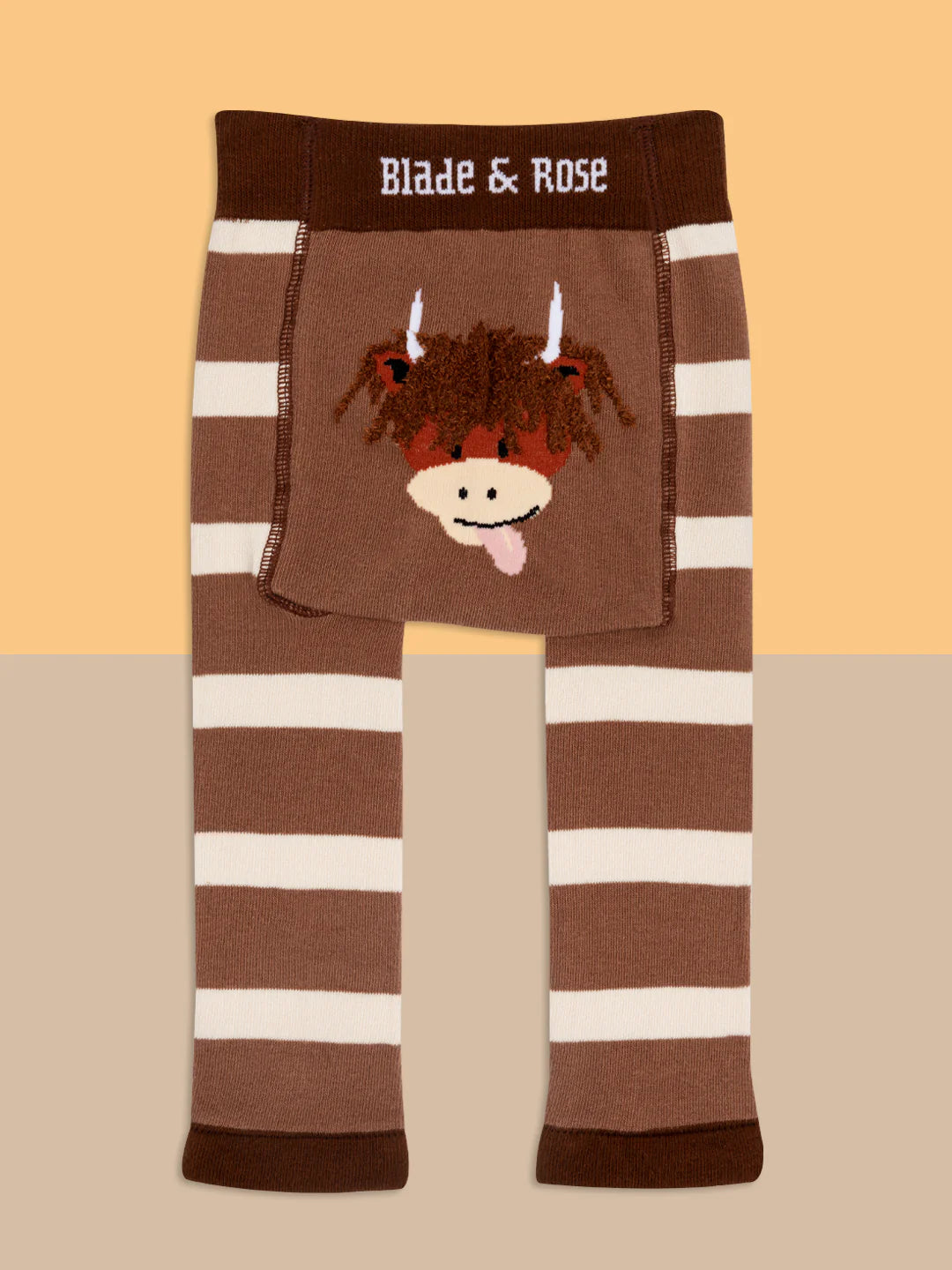 Flat lay of Neutral Highland Cow Leggings showing stretchy waistband and adorable cow print.