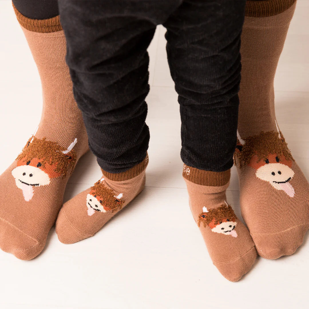 Close-up of Neutral Highland Cow Socks with soft cotton fabric and knit details