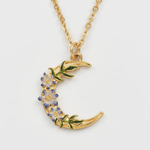 Close-up of Nightshade Moon Pendant Necklace with hand-painted nightshade flower details.
