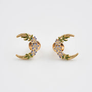 Nightshade Moon gold stud earrings with violet enamel flowers.