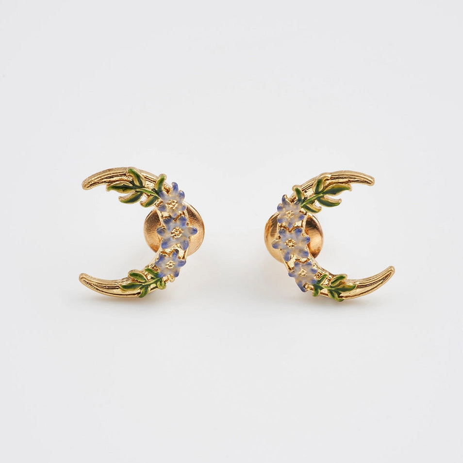 Nightshade Moon gold stud earrings with violet enamel flowers.