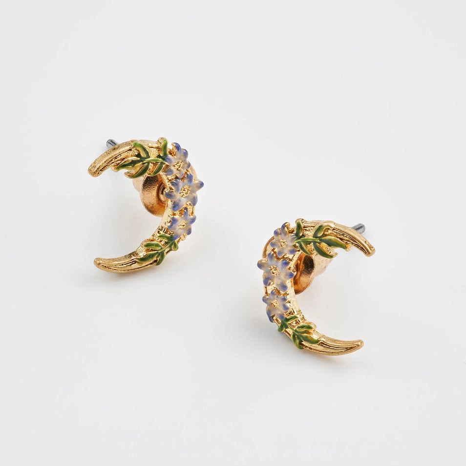 Close-up of Nightshade Moon enamel flower crescent earrings.