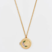 Nightshade Moon Round Gold Locket Necklace on gold chain – closed view.