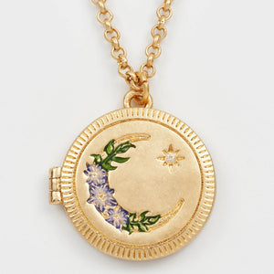 Close-up of Nightshade Moon Round Gold Locket with enamel flowers and cubic zirconia moon.