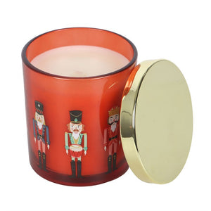 Red Nutcracker Festive Spice candle with gold lid and classic nutcracker illustrations.
