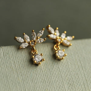 Close-up of Oak Leaf Japanese Stud Earrings on a textured surface, showcasing the cubic zirconia design in gold-plated sterling silver.