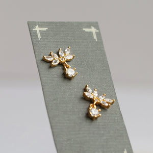 A pair of Oak Leaf Stud Earrings displayed on a presentation card, highlighting their delicate and elegant craftsmanship.