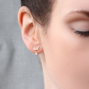 A model wearing the Oak Leaf Stud Earrings, demonstrating their subtle sparkle and elegant design for everyday wear.