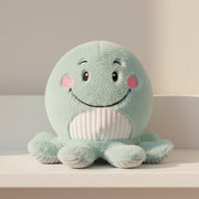 Mint green octopus soft plush toy on white shelf lifestyle shot