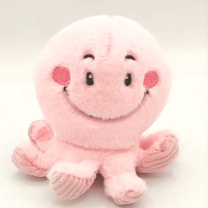 Pink octopus plush toy close-up showing embroidered face detail