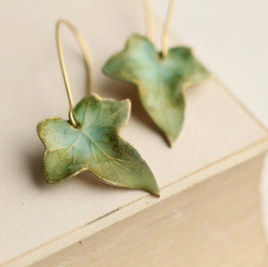 Handmade olive green ivy leaf earrings with intricate veining, inspired by nature. Crafted in solid brass with a hand-painted watercolour finish.