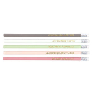 Flat lay of five pastel pencils featuring literary quotes in gold foil.