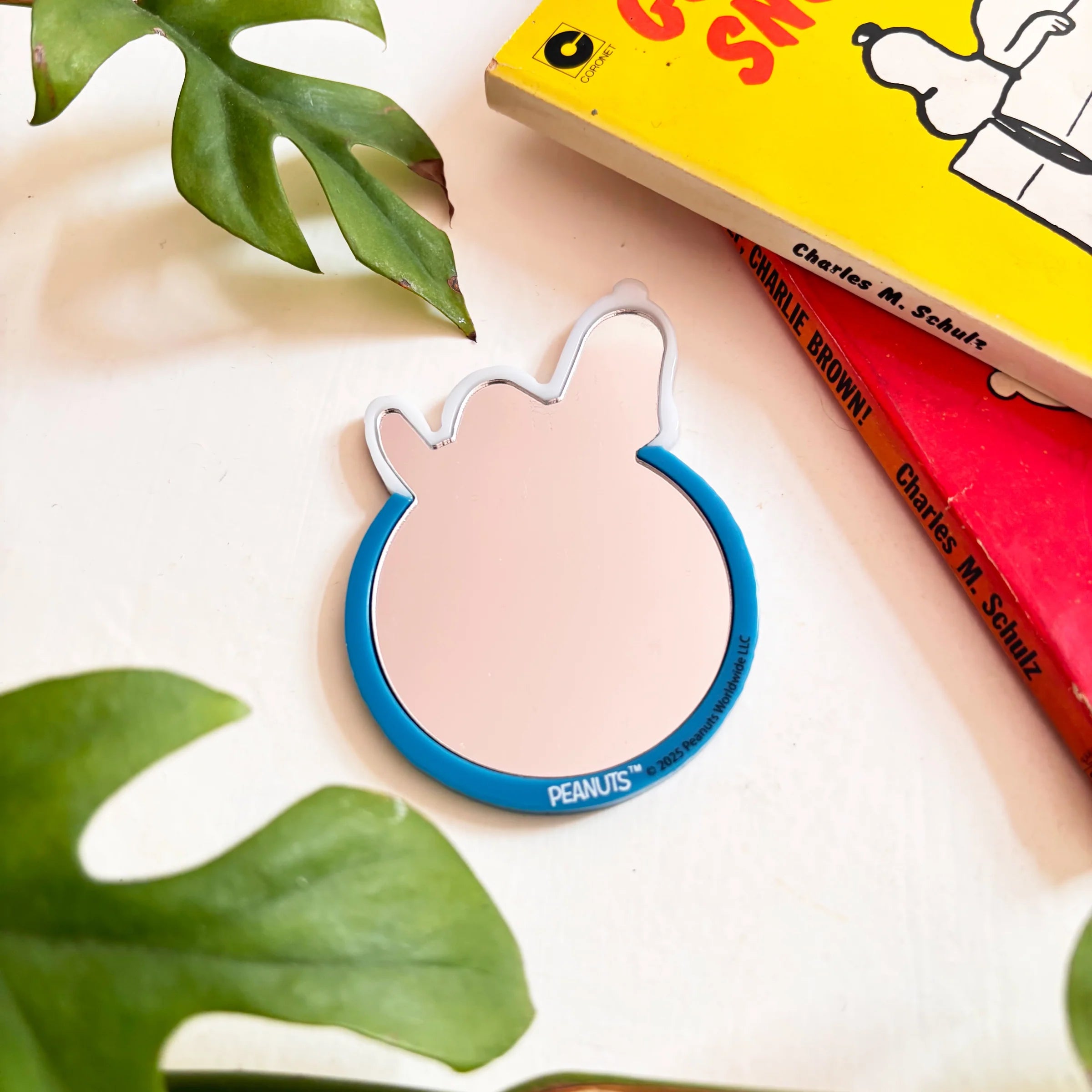 Back view of Peanuts Snoopy Smiley compact mirror with mirror surface.