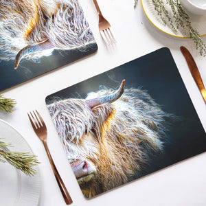 Peekaboo Highland Cow Placemat on a dining table with cutlery and a cup of tea.