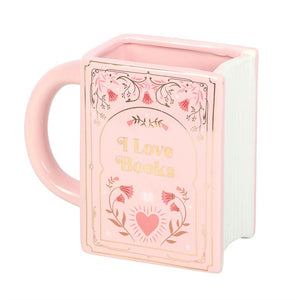 Pink book shaped ceramic mug with gold lettering “I Love Books” on white background.