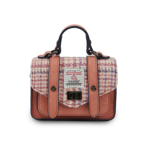 Islander Harris Tweed Wee Satchel with a Pink and Purple Dogtooth design and a black PU leather Body.