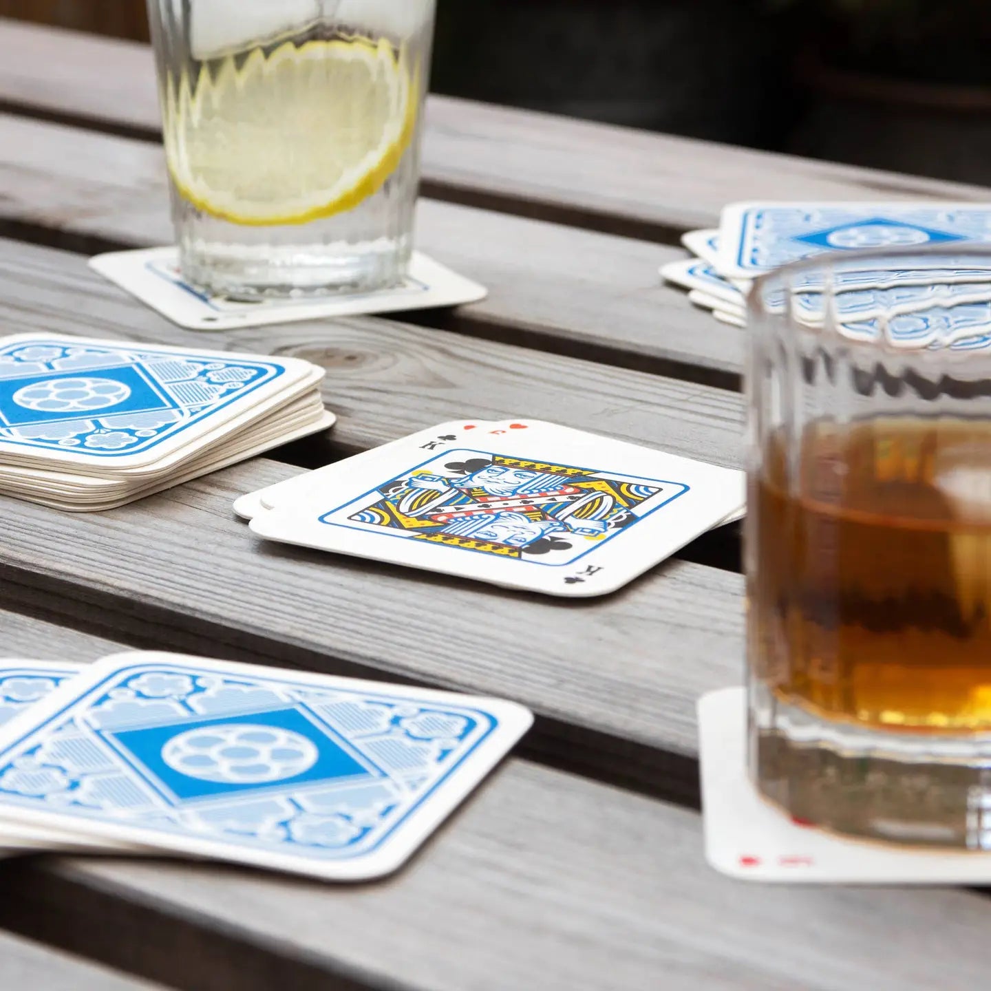Playing Card Drink Mats used as coasters with drinks.