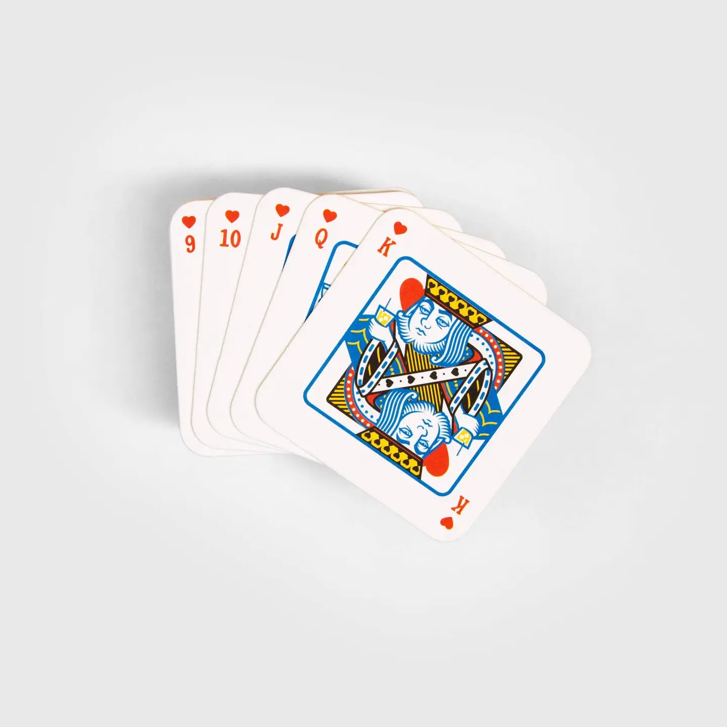 Set of Playing Card Drink Mats fanned out in a hand.