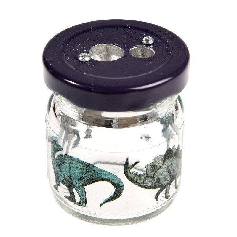 Dinosaur glass jar pencil sharpener angled view on white background