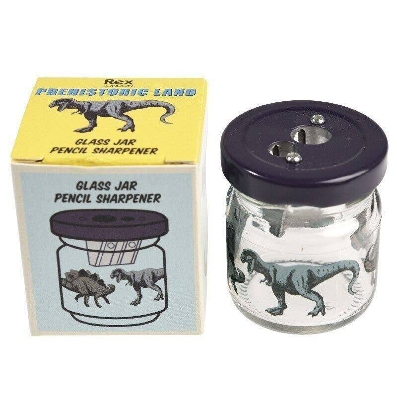 Dinosaur pencil sharpener jar beside packaging on white background
