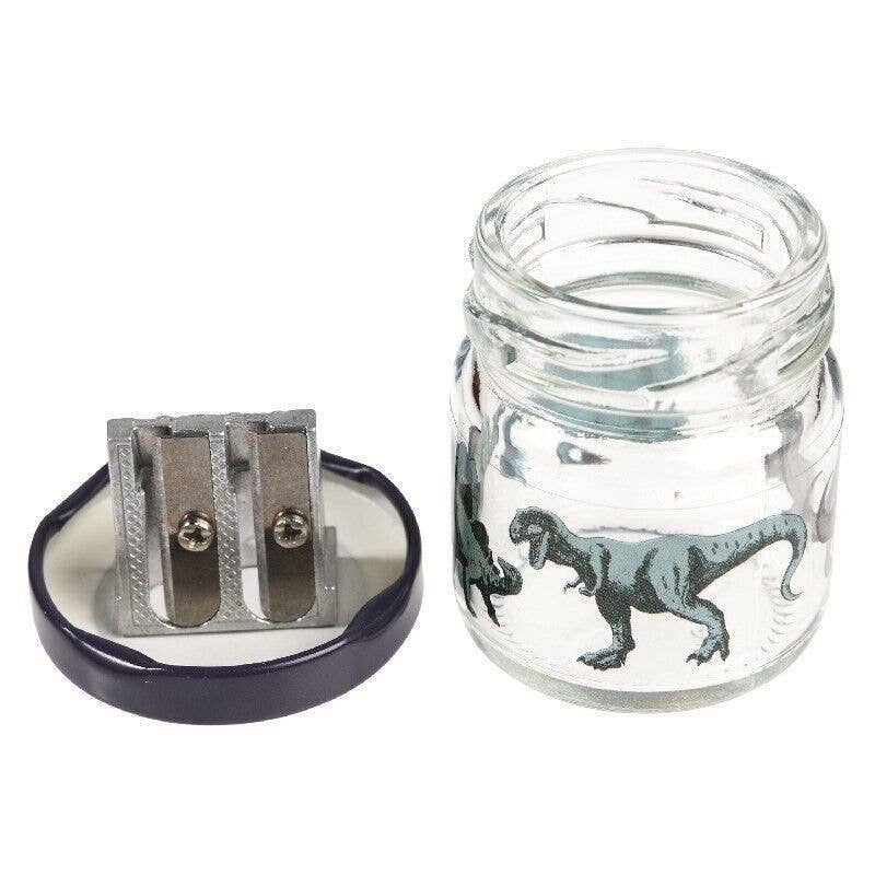 Dinosaur pencil sharpener disassembled showing lid and open jar