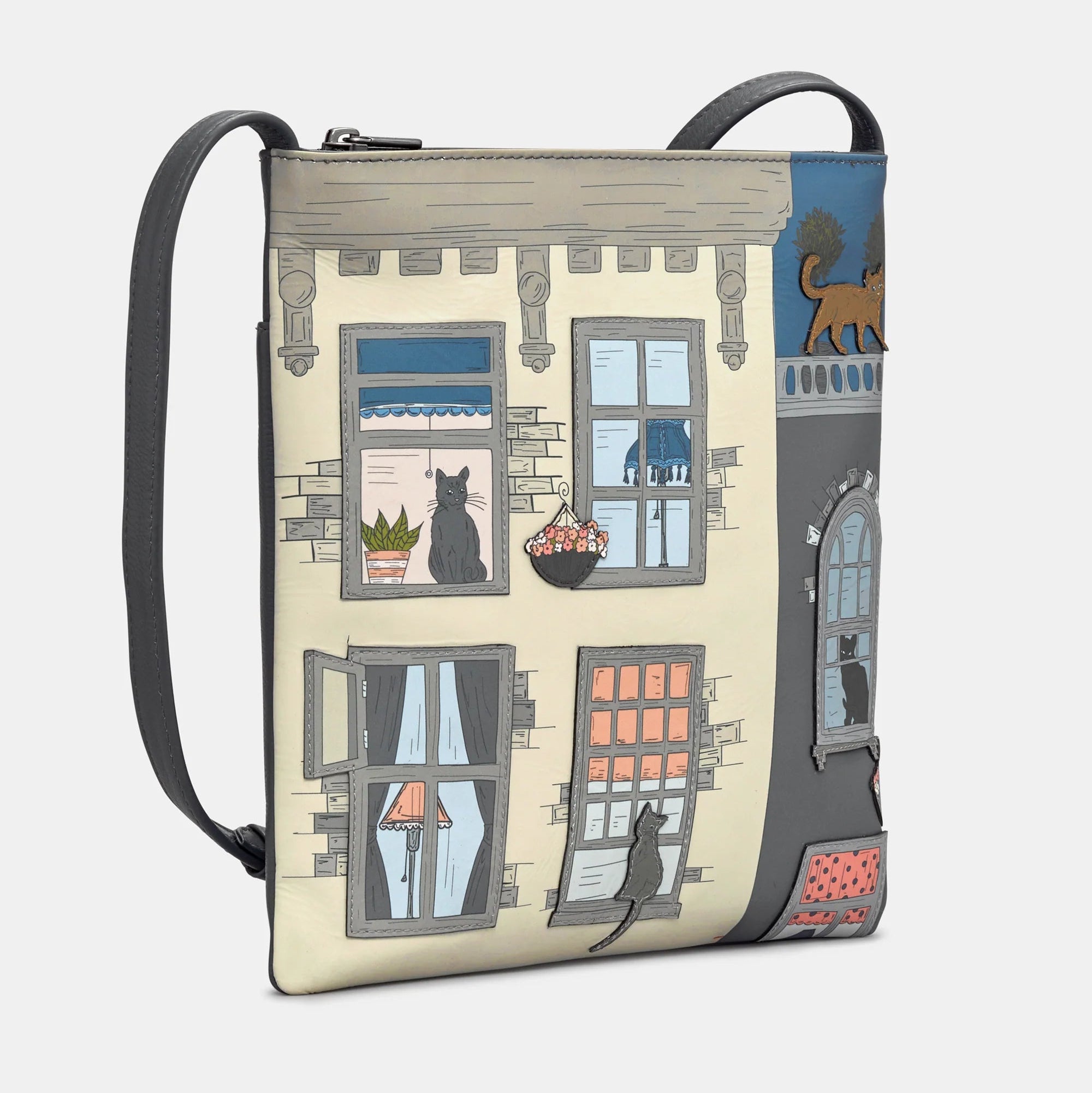 Side angle of Yoshi Purrfect Neighbours cross body bag showing detailed cat appliqués and soft leather finish.