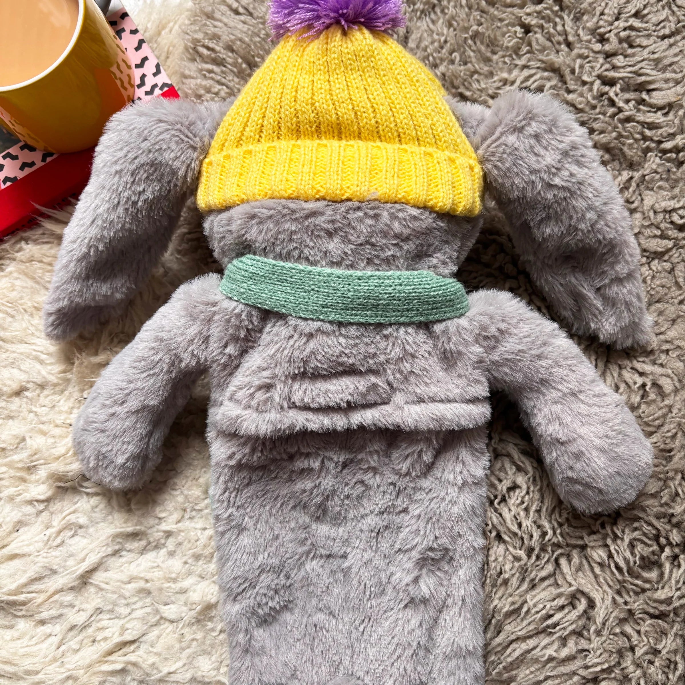 Back view of plush bunny showing soft texture and floppy ears.