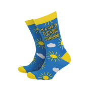 Men’s bamboo socks with bright yellow sun and cloud pattern on a blue background and bold text reading “I’m a Ray of Fucking Sunshine” – UK 8-11 size.