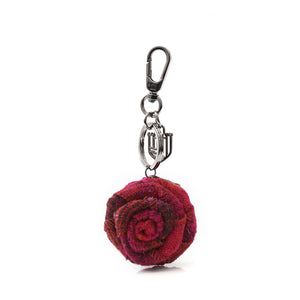 A vibrant red tartan Harris Tweed rose keyring, celebrating Scottish heritage and style.