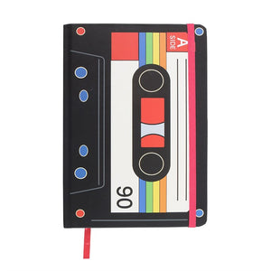 Front cover close-up – A5 notebook with cassette tape print and red elastic band.