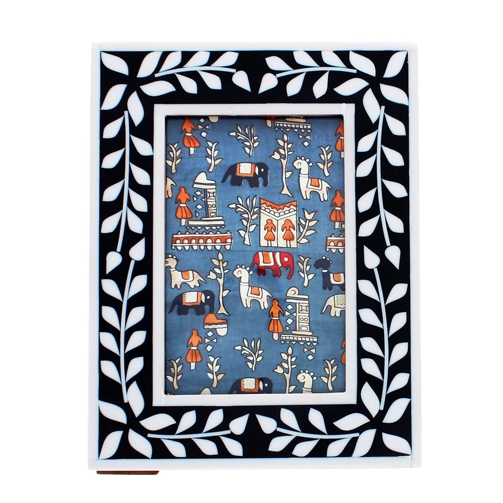 Front view of navy and white leaf-patterned resin photo frame with glass insert.